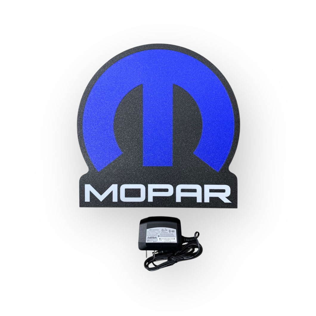 Mopar led sign with power adapter on a white background