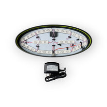 Load image into Gallery viewer, Oval-shaped LED light fixture with wiring and a power supply on a white background