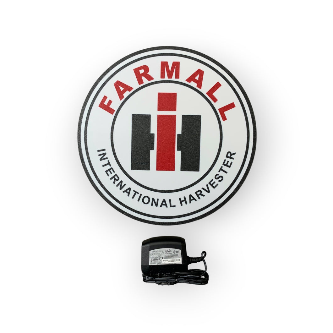 Farmall International Harvester led sign with a black power adapter on a white background