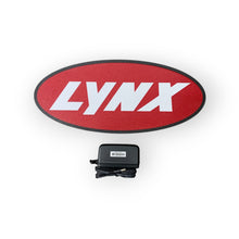 Load image into Gallery viewer, Red oval with &#39;LYNX&#39; led sign and a power adapter on a white background