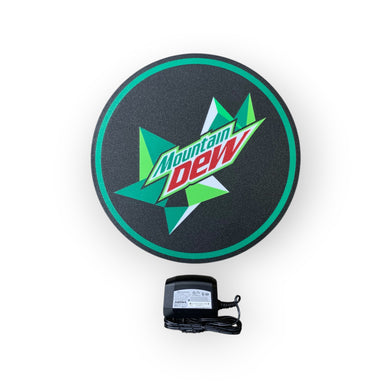 Round Mountain Dew led indoor sign with a power adapter on a white background