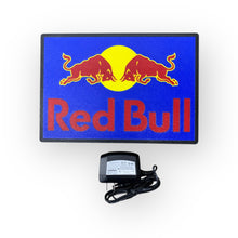 Load image into Gallery viewer, Red Bull led indoor sign on a blue background with an adapter below