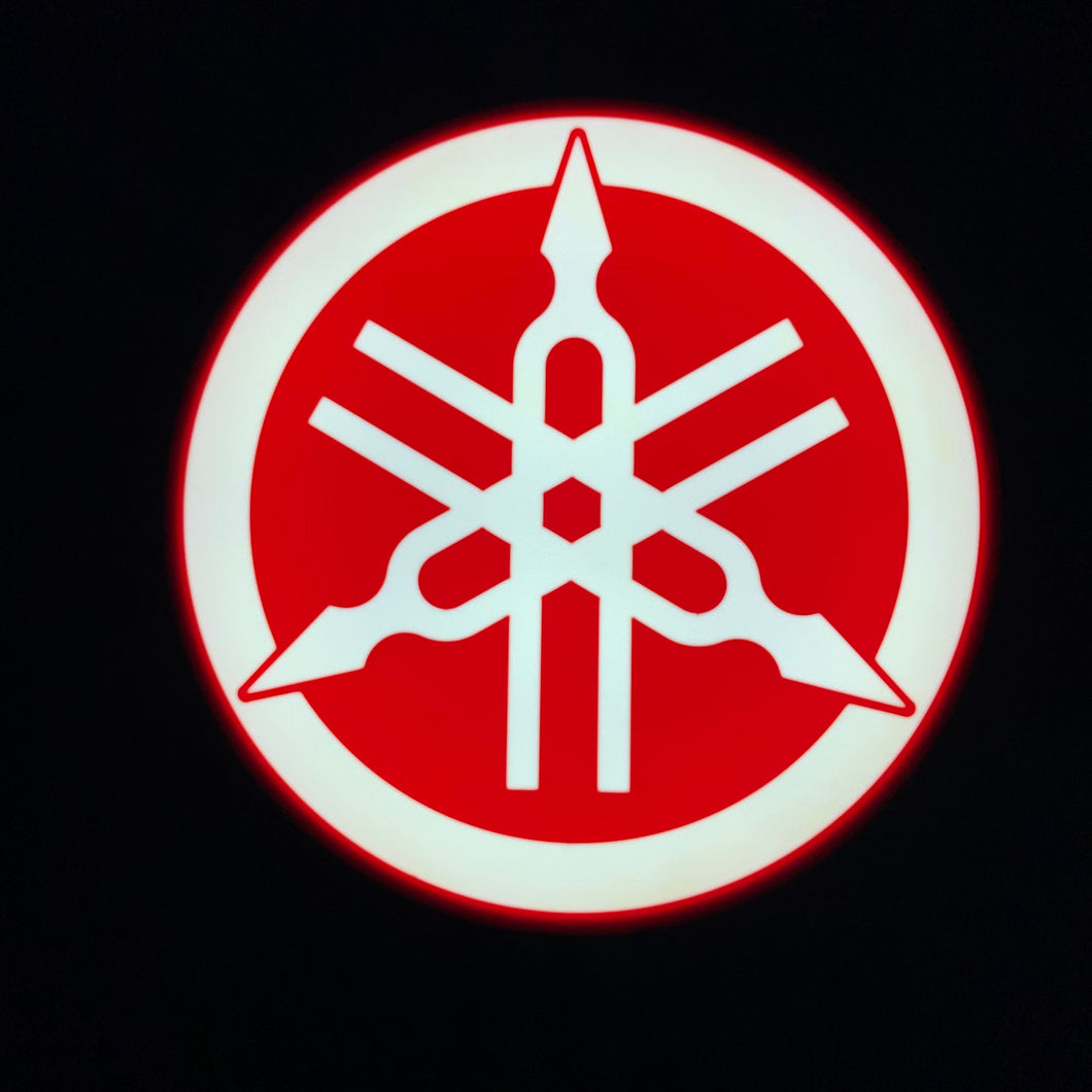 Yamaha led sign lit up on a black background