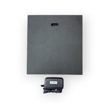 Load image into Gallery viewer, Black rectangular electronic device with a power adapter on a white background