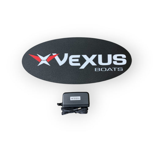 Vexus Boats led sign on a black oval with a power adapter below on a white background